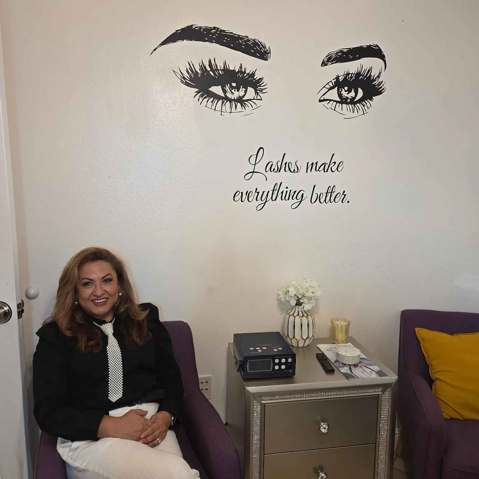 Eliza Nieto standing in her wellness studio, welcoming clients at Eliza Balance Wellness & Beauty