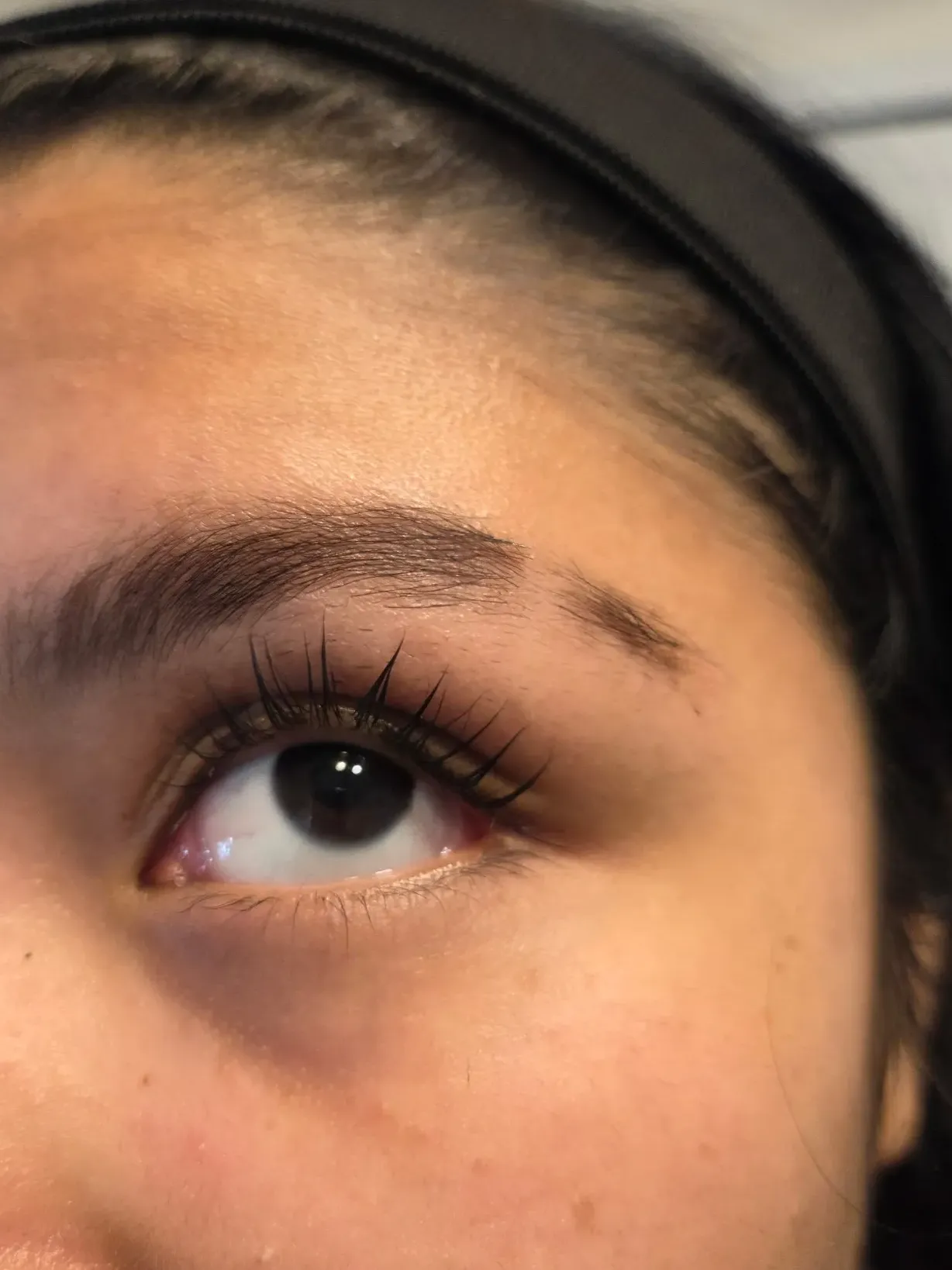 Lash tint treatment enhancing natural eyelashes in a professional spa setting at Eliza Balance Wellness & Beauty